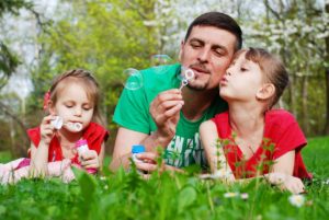 Dad spending special moments with his children