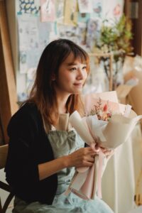 Woman giving flowers
